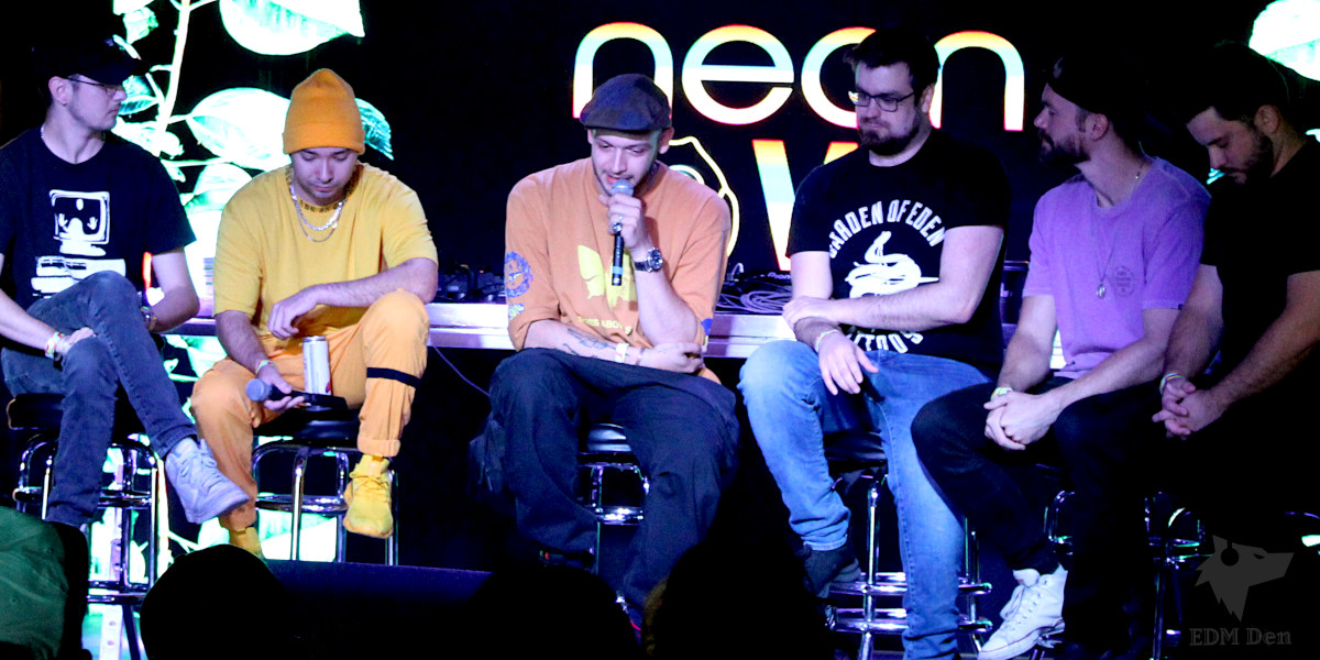 EDM Mental Health Event ft. DROELOE (photo of him speaking with other DJs on stage)