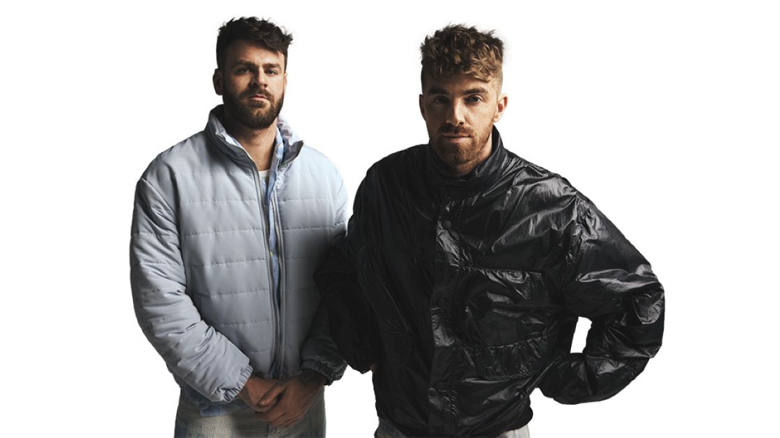 mainstream DJs, the Chainsmokers (photo of duo wearing warm jackets)